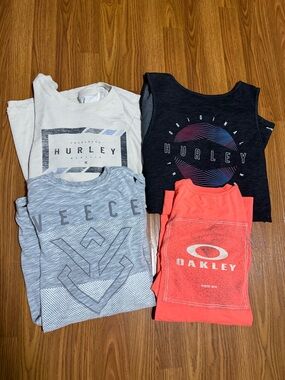 Buckle 4 Shirt Bundle Size XL. Includes 2 Hurley, 1 Oakley, & 1 Veece.